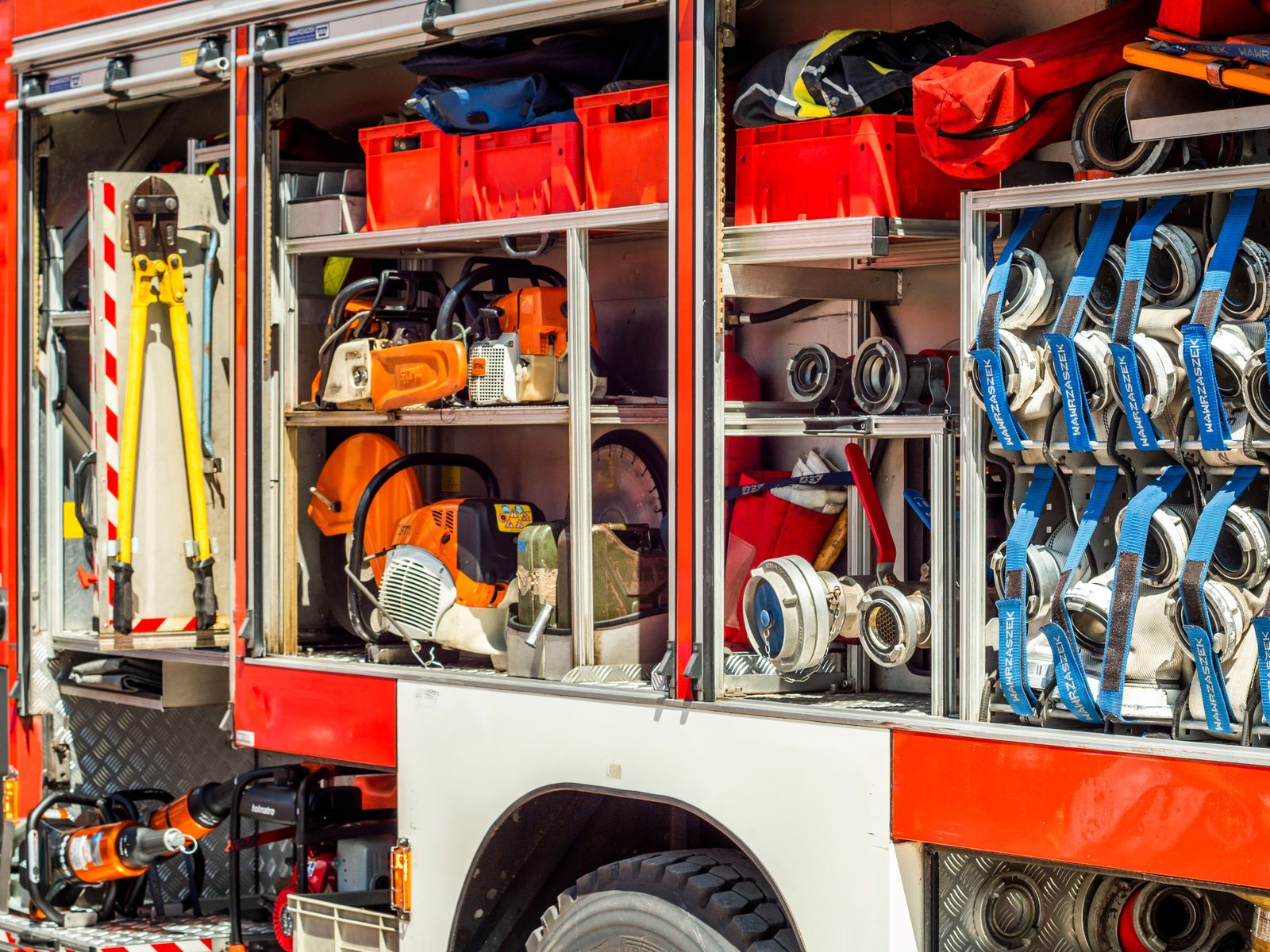 Fire apparatus compartments loaded with tools and equipment